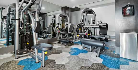 Fitness center at Axis Admiral Hill Apartments in Chelsea MA