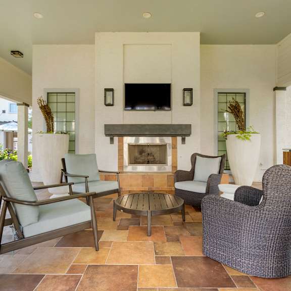 a living room with furniture and a fireplace at Summerwind in Texas 77584