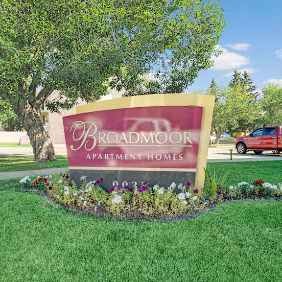 The exterior sign of Broadmoor Apartment Homes. 