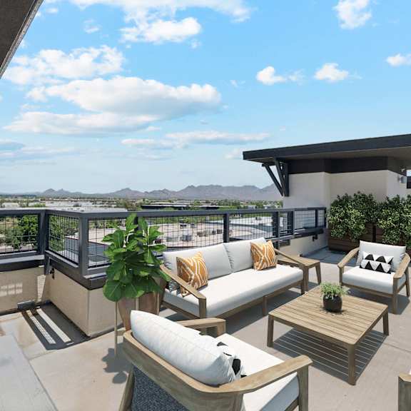 A modern outdoor living space with a fire pit and comfortable seating.