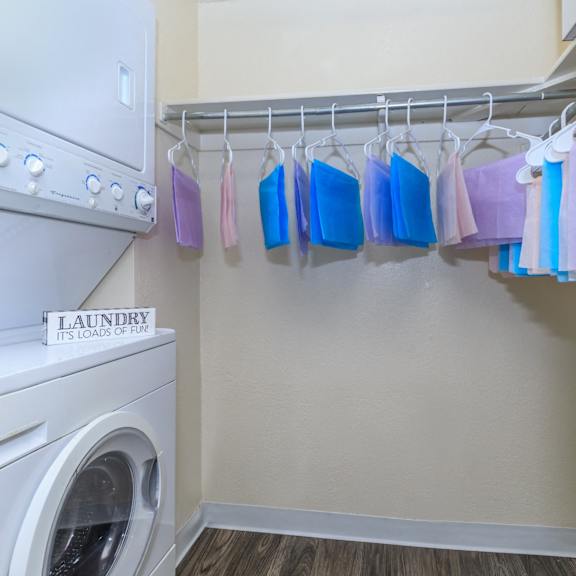 A laundry sign is on a washing machine.