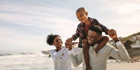 Family enjoying on beach at Brea Grove Residences Apartments, Brea, CA
