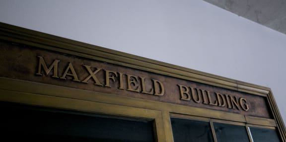 the building building with a sign on the top of it at Maxfield Lofts, Los Angeles, CA 90014