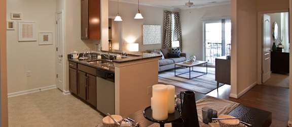 A kitchen with a dining table and chairs. at Kensington Place Apartments, Woodbridge, Virginia