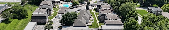 A bird's eye view of a residential area with houses and apartment buildings.