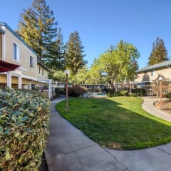 view of apartment buildings and landscaping