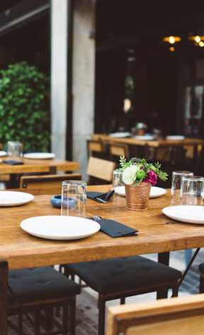an empty restaurant with wooden tables and chairs at Heritage at Mount Holly, New Jersey