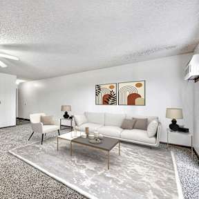 A living room with a grey carpet and a white sofa. at Somerset Apartments, Des Moines, IA, 50315