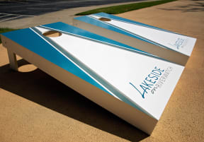 a small bench with a blue and white sign on it at Lakeside on Riverwatch in Martinez, GA 30907