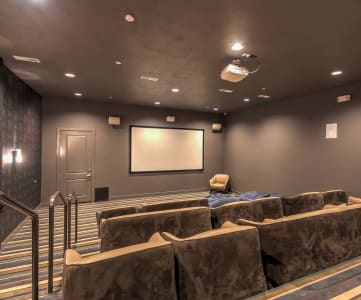 a large screening room with a projector screen