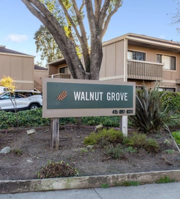 exterior of apartments with Walnut Grove sign