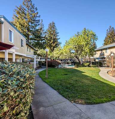 view of apartment buildings and landscaping