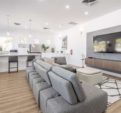 a living room with a couch and a television
