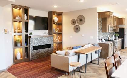 a living room with a couch and a table  at Timber Ridge, Forest Lake, 55025