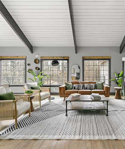 A living room with a green couch and a coffee table.