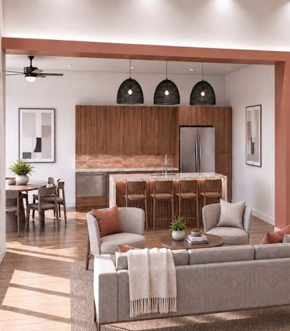 A modern living room with a grey sofa and a wooden cabinet.