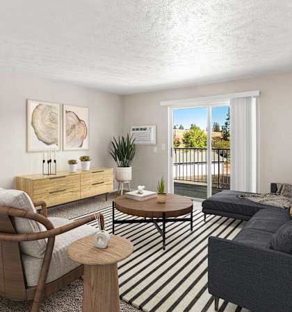A living room with a grey couch, a wooden chair, and a coffee table.