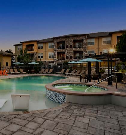 Resort-inspired pool with heated spa - Acadia at Cornerstar Apartments