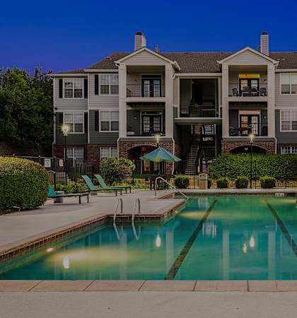 Resort-style swimmingn pool and heated spa at dusk - Emmersyn at Lone Tree