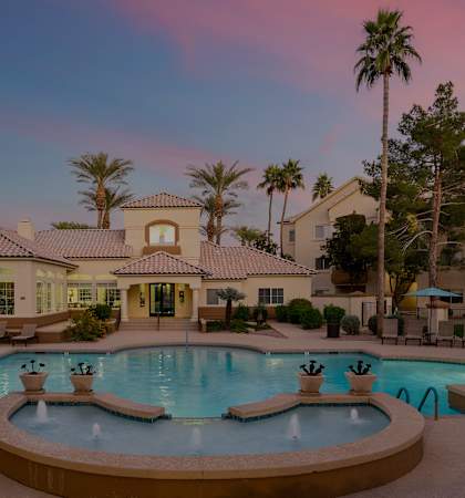Resort-style swimming pool at dusk - Sonterra Apartments at Paradise Valley