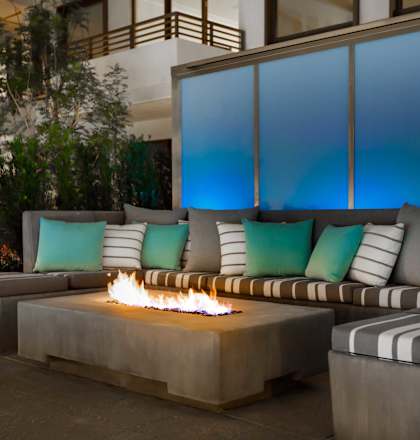 Outdoor patio with firepit at Grey House, Houston