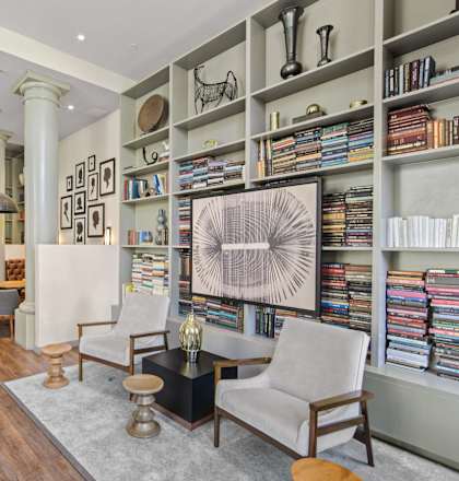 a living room with a bookshelf full of books