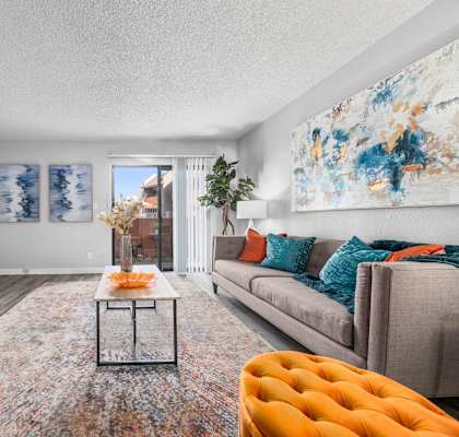 a living room with a couch and a tv