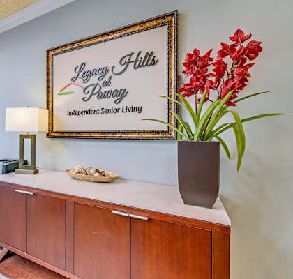 A framed sign that says Legacy Hills at Pawley Independent Senior Living.