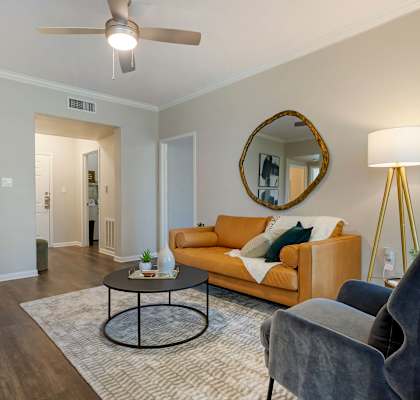 a living room with a couch and a coffee table at Madison on the Meadow in Stafford, Texas 77477
