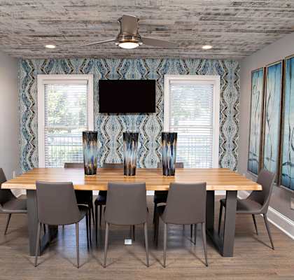 a dining room with a table and chairs in front of a window at Lakeside on Riverwatch in Martinez, GA 30907