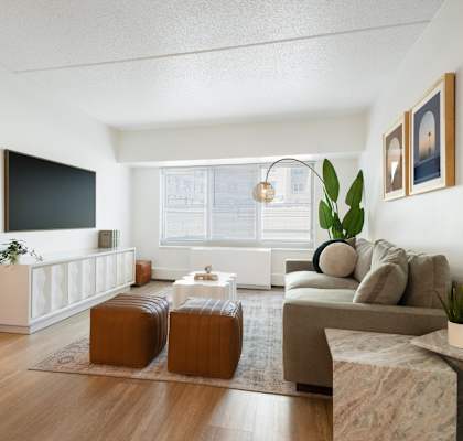 a living room with a couch and a table and a television