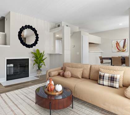 A living room with a fireplace and a couch.