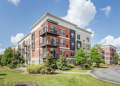 a building with a street in front of it at Avant at the Arboretum, Lisle, Illinois 60532