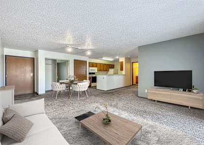 a living room with a couch and a tv at Autumn Park, South Dakota