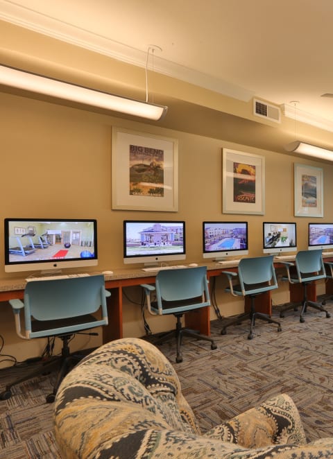a lounge area with chairs and a table with computer monitors at Cypress Creek at Parker Blvd, Royse City, 75189