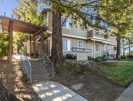 exterior of apartment building with Redwood Landing sign