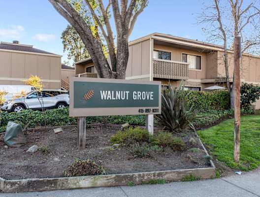 exterior of apartments with Walnut Grove sign at Walnut Grove Apartments, Novato, CA, 94947