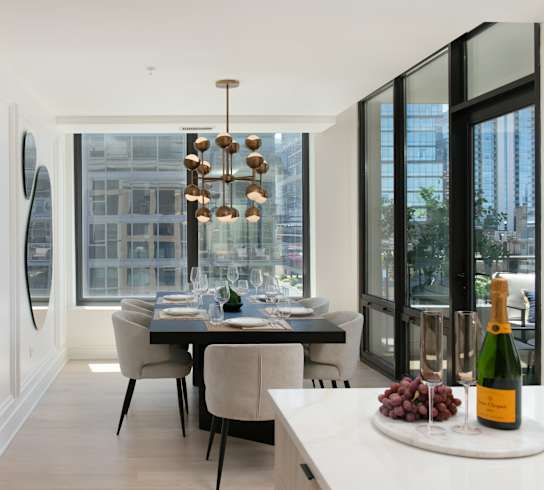A modern dining room with a table set for two at Chateau on Wells, Chicago, Illinois