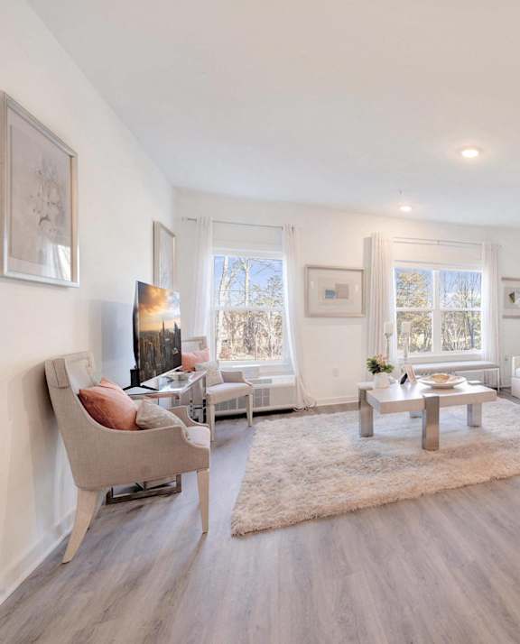 a living room with a couch and a table at The Franklin at Hillsborough Apartments, New Jersey, 08844