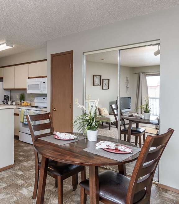 A kitchen with a dining table and chairs.at Autumn Park, Sioux Falls South Dakota