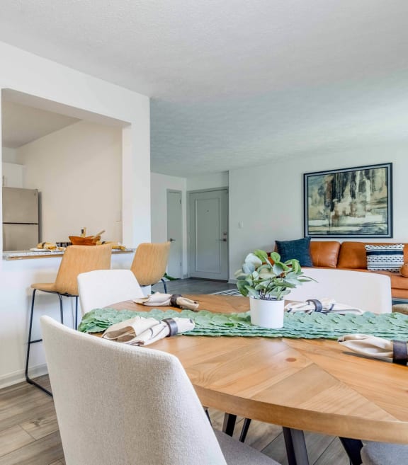 a dining room and kitchen with a table and chairs at The Waters at Chenal, Little Rock, Arkansas
