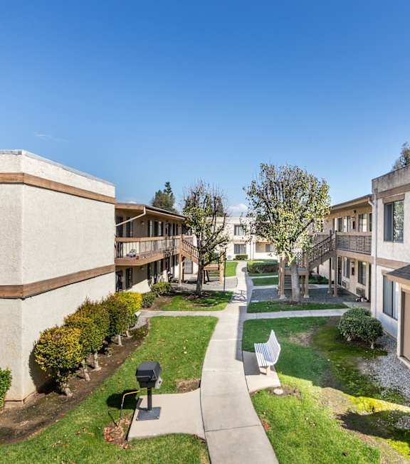 Exterior Walkways with Trees at Whispering Fountains Riverside, Riverside, CA, California