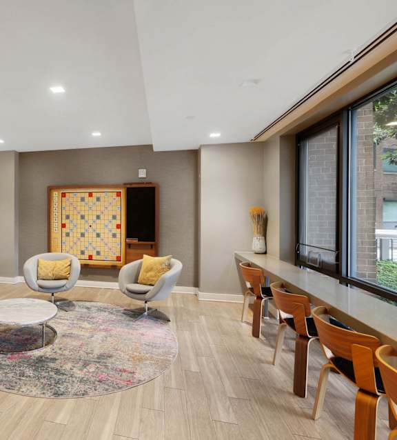 Clubroom with desks and comfortable chairs at The Graham at Southern Towers, Alexandria, VA, 22311