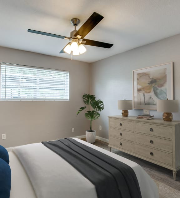 a bedroom with a bed and a ceiling fan at Tara Oaks in Houston, TX