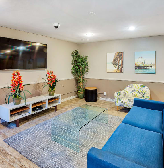 a living room with furniture and large windows