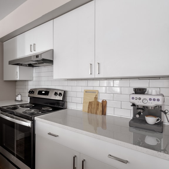 a kitchen and dining room with a table and chairs at Arcadia Apartments, Centennial, Colorado