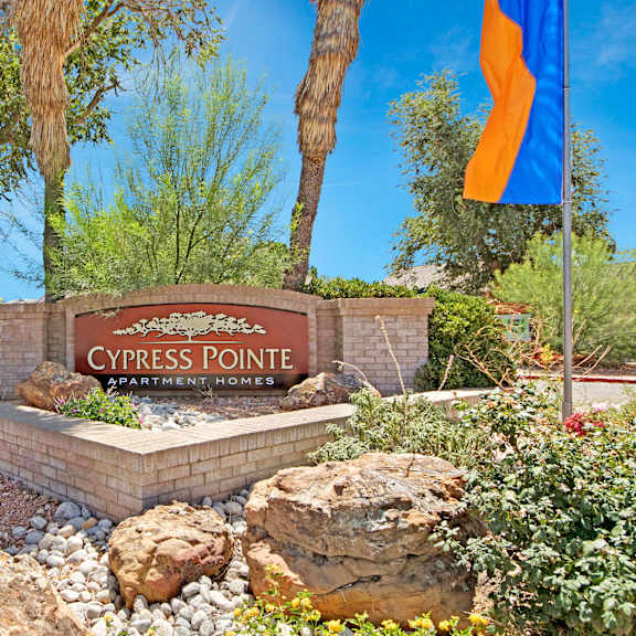 The exterior sign and building of Cypress Pointe Apartments. 