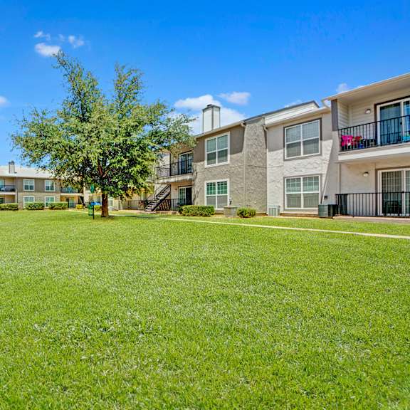 The exterior green space at High Plains, surrounded by the apartment buildings. 