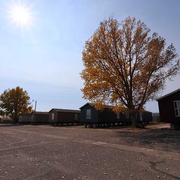 a row of small houses on the side of a road at Country Lane, Cheyenne, Wyoming