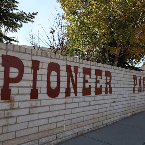 a brick wall with the pioneer mall logo on it at Pioneer Park, Green River, Wyoming
